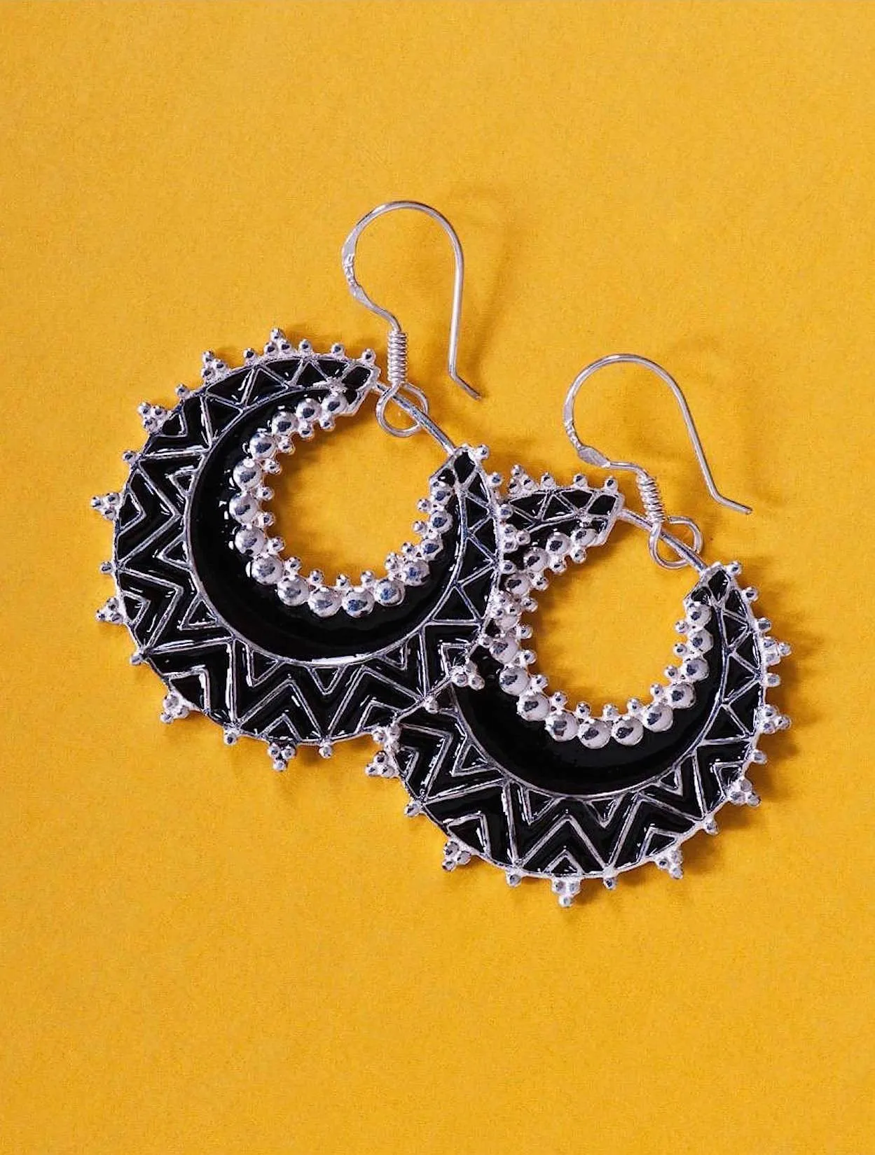 Exquisite, crescent shape, dangle earrings with fine black enamel work