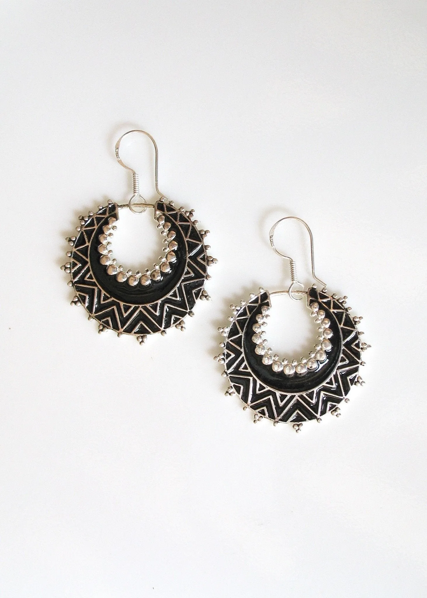 Exquisite, crescent shape, dangle earrings with fine black enamel work