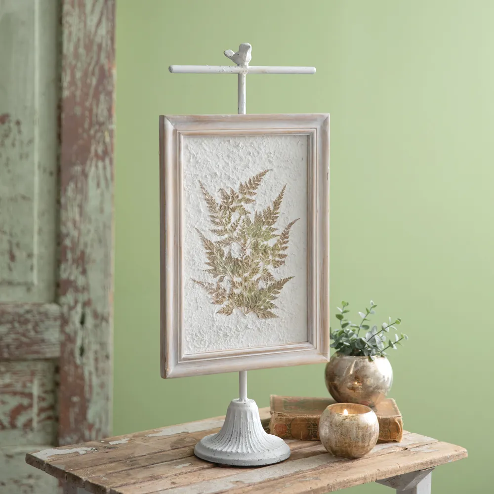 Pressed botanical fern artwork on stand