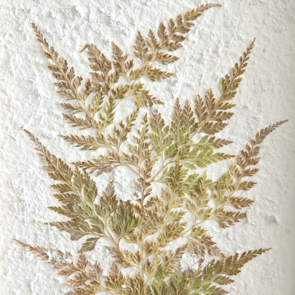Pressed botanical fern artwork on stand