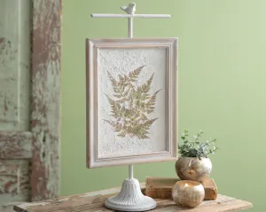 Pressed botanical fern artwork on stand