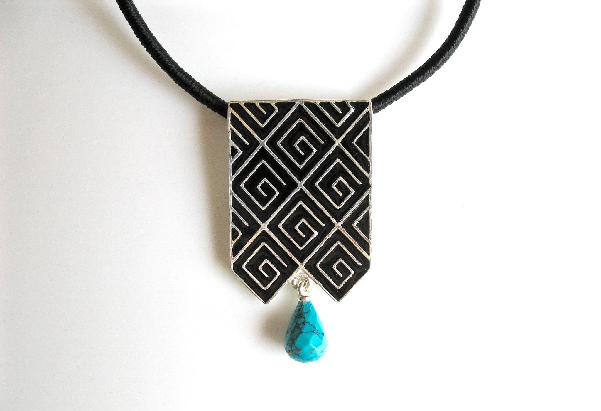 Stunning, long rectangular pendant with fine black enamel work and a turquoise drop